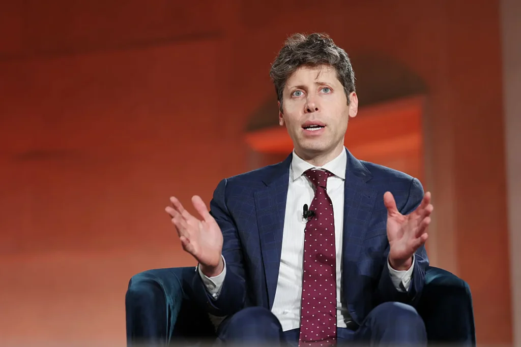 Sam Altman speaking at a technology conference discussing AI's impact on jobs